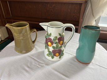 Three Earthenware Pitchers, One Signed