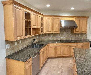 Entire Angled Run Of Custom Cabinets, Countertops And GE Monogram Cooktop