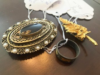 A Vintage Onyx Brooch, Leaf Pin, And Leaf Ring