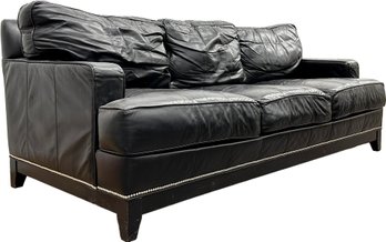 A Modern Leather Sofa With Glam Nailhead Trim By Restoration Hardware