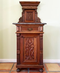 An Antique German Carved Mahogany Wash Stand With Marble Top