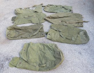 A Grouping Of Old Military Canvas Duffle Bags