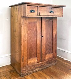 An Antique Oak Writing Desk With Storage