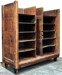 An Antique Industrial Cart With Stacked Storage Cubes