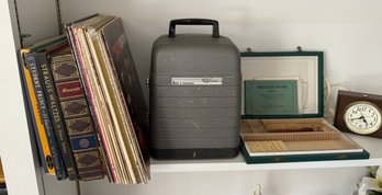 Records, Bell And Howell Projector, And Clock