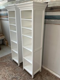 A Pair Of White Pottery Barn Cabinets With Six Shelves