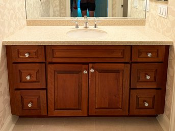 A Bathroom Vanity With Solid Maple Cabinets, A Corian Counter And A Kohler Sink And Fittings