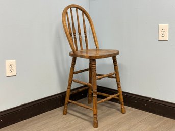 A Vintage Counter-Height Stool With Backrest