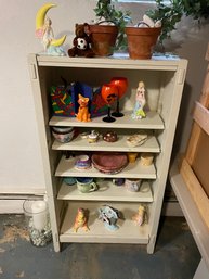 Overflowing White Cabinet With Miscellaneous Handmade Art Collectibles Planters Rock Candle Holder & More