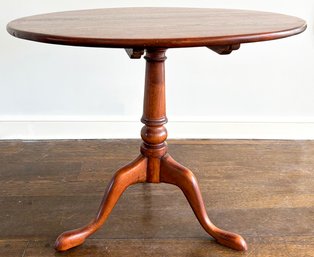 An Antique English Oak Tilt Top Occasional Table