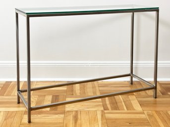 A Brushed Steel Console With Glass Top