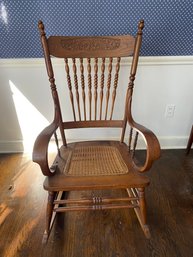 Antique Rocking Chair With Pressed Back And Caned Seat