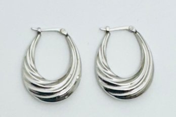 SIGNED CARLA 14K WHITE GOLD ELONGATED SWIRL HOOP EARRINGS