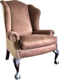 An Upscale Arm Chair With Contrasting Back Upholstery And Nailhead Trim