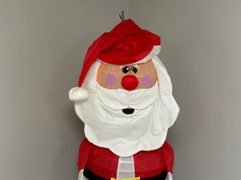 A Cartoon Santa With A Spring Form Body