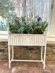 Wicker Plant Holder With Lots Of Faux Flowers