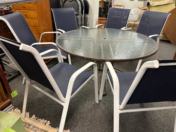Patio Table With 6 Blue And White Chairs
