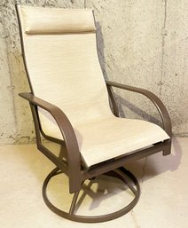 A Tubular Steel And Mesh Outdoor Chair