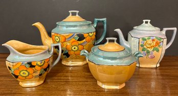 Two Lusterware Teapots, Creamer And Sugar From Japan