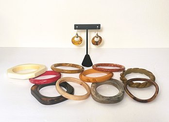 Ten Bangle Bracelets And A Pair Of Earrings