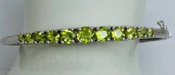 BEAUTIFUL STERLING SILVER AND GRADUATED PERIDOT BRACELET