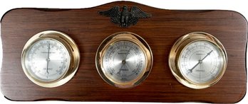 A Vintage Barometer, Thermometer, And Humidity Gauge