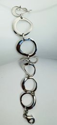 SIGNED DOBBS STERLING SILVER WAVY CIRCLE LINK BRACELET - ITALY