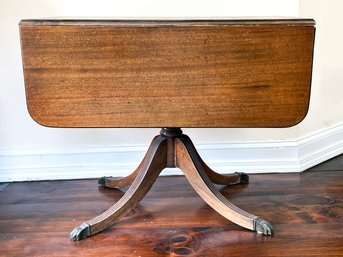 A Vintage Mahogany Drop Leaf Pedestal Table By Brandt