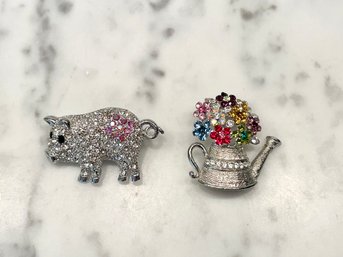 Two Adorable Encrusted Fashion Pins Including Flower Filled Watering Can