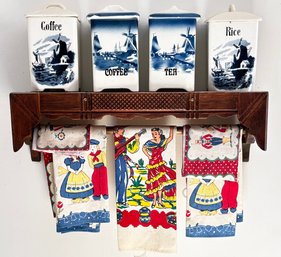 Vintage Porcelain Canisters, Tea Towels, And A Carved Oak Kitchen Shelf