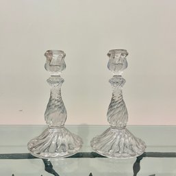 A Pair Of Glass Candlesticks