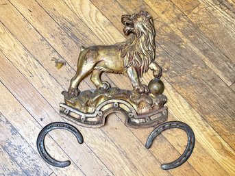 A Vintage Cast Lion And Horse Shoe Decor