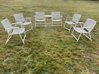 Vintage Metal Patio Set Of Four Folding Chairs And A Dual Seat Bench With A Center Table.