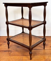 A Vintage Three Tiered Mahogany And Cane Side Table In Coastal Plantation Style