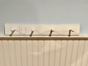 A Land Of Nod Wall Mounted Coat Rack With Pegs