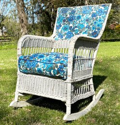 A Vintage Wicker Arm Chair - With Fabric Panel And Cushion
