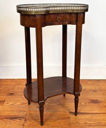 A Vintage Kidney Form Telephone Table With Drawer, Brass Rail, And Marble Top