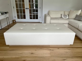 A Custom Leatherette Tufted Ottoman