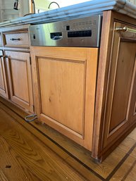 A Bosch Dishwasher With Wood Panel