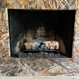 A Gas Fireplace Insert - Wood Paneled Room