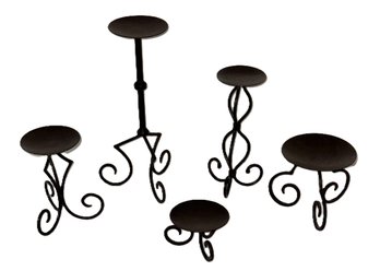 Set Of Five Metal Candle Stands With Scrollwork Bases In Graduated Heights