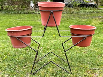 A Vintage Wrought Iron Star Form Plant Stand