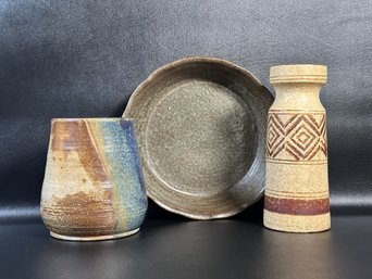 A Beautiful Grouping Of Pottery In Earth Tones