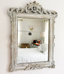 An Elegant Carved Wood Framed Mirror In Faux Distressed Finish