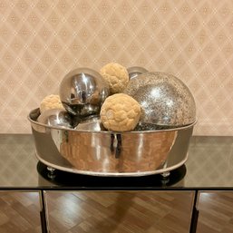 A Collection Of Glass And Metal Decorative Balls In A Silver Plated Bowl