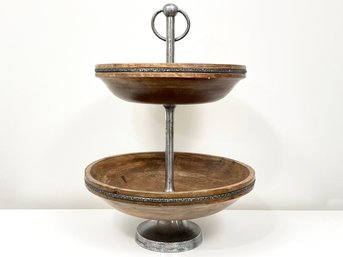 A Two Tiered Wood And Metal Serving Stand