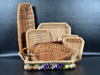 A Small Grouping Of Woven Trays & Baskets