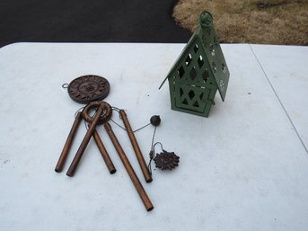 Wind Chimes And A Cute Green Swiss Chalet Style Candle Lantern
