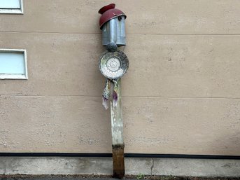 Assemblage Garden Art: A Quirky Character On A Post