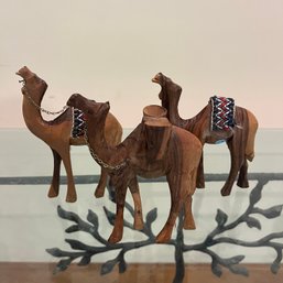 A Set Of 3 Carved Wood Camels